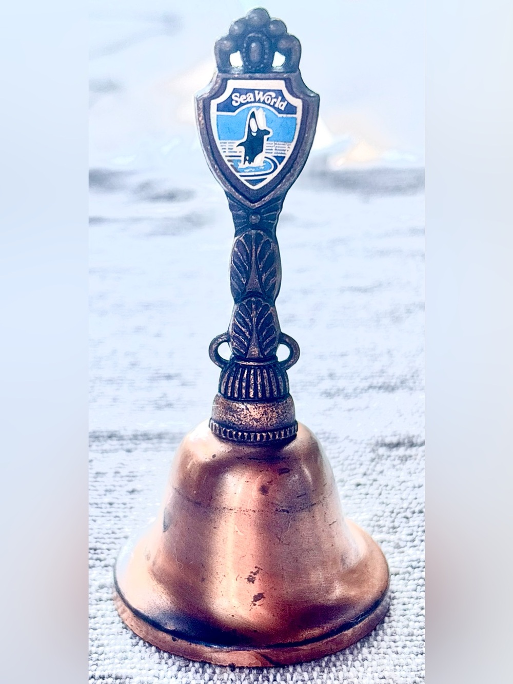Antique-Style Copper Tone Miniature Table Bell with Sea World Orca Crest